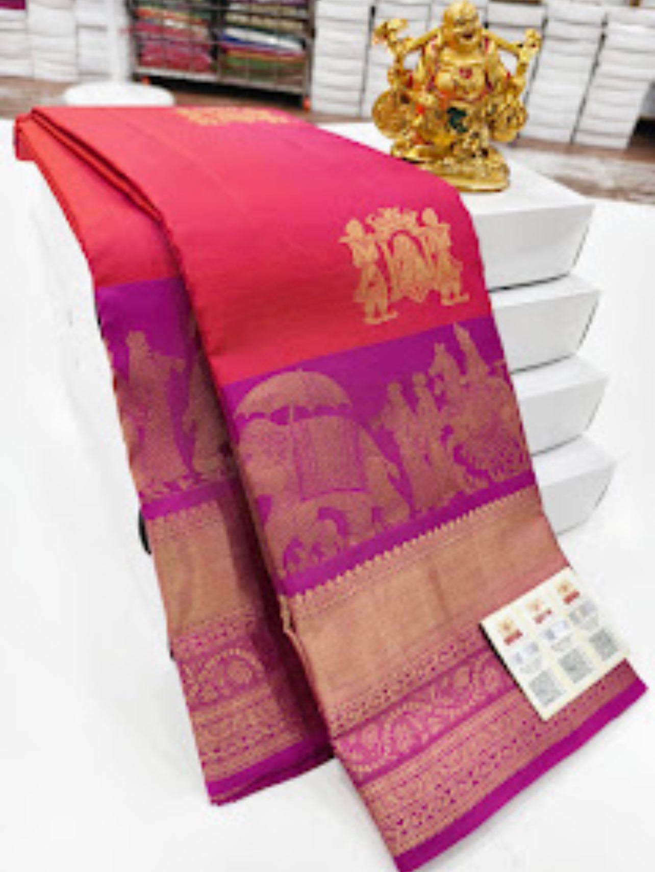 Majestic Reddish Pink Kanjipuram Pure Silk Saree with Regal Purple Zari Border – A Timeless Statement of Grace